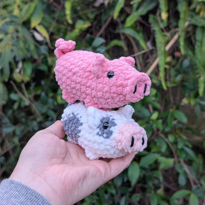 Two crocheted pigs 