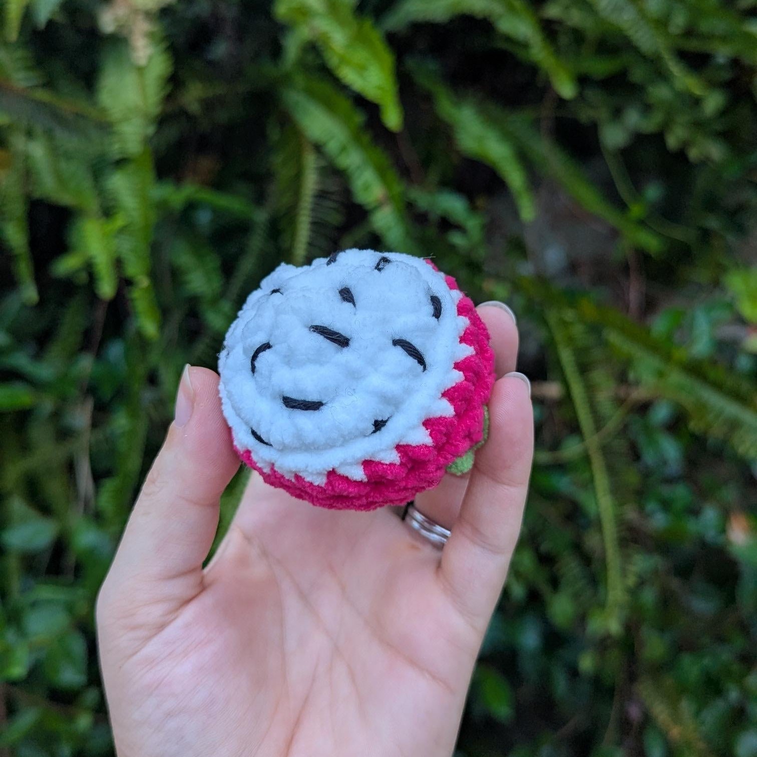 A round crocheted dragon fruit