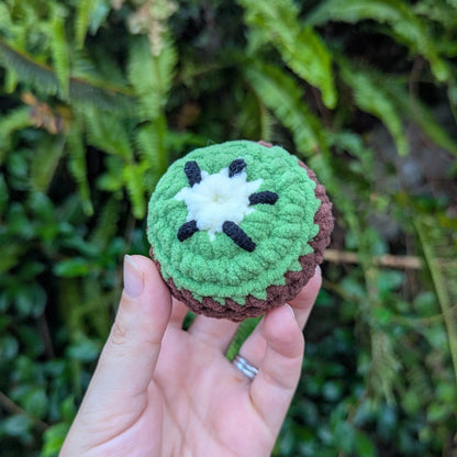 A round crocheted kiwi fruit