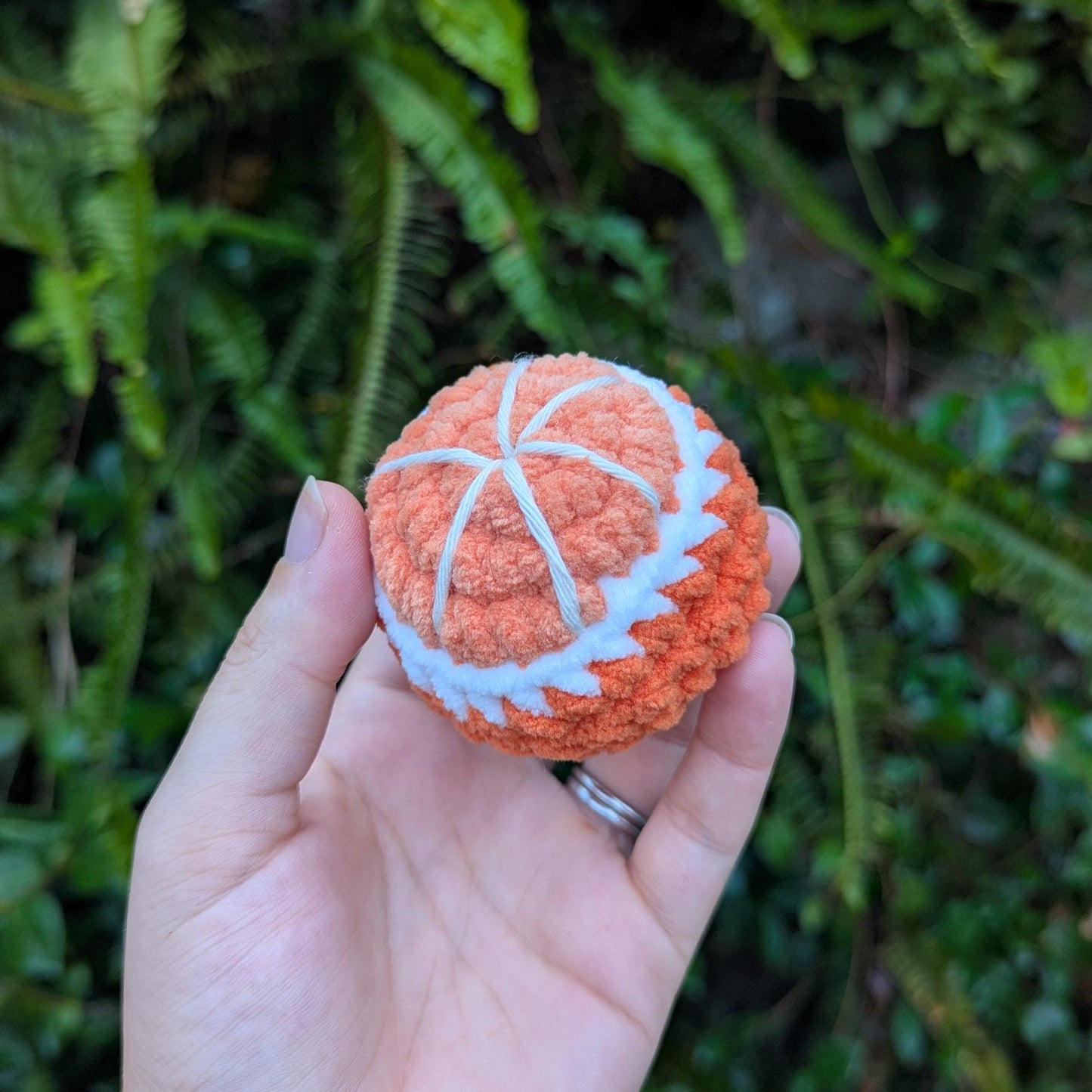 A round crocheted orange