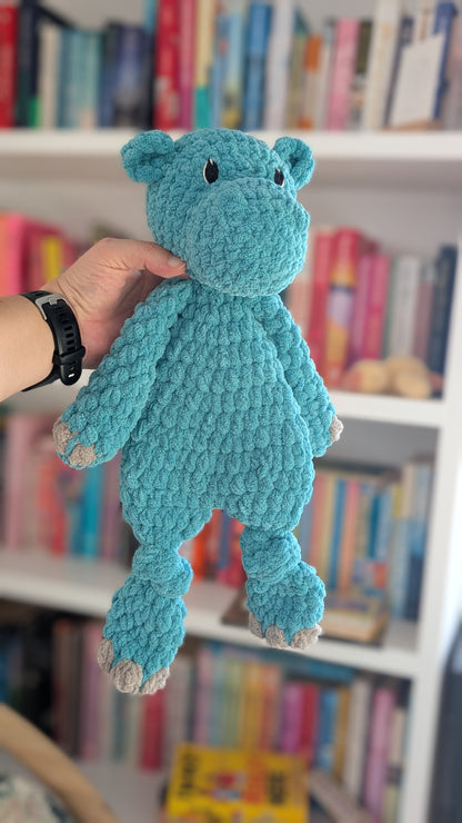 Hippo Crochet Lovey Snuggler toy in a teal colour. The head is stuffed but body is unstuffed.
